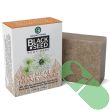 "Amazing Herbs Black Seed Soap bar resting on natural wooden surface"

