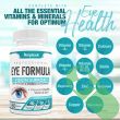 Amplicell Eye Formula vision support – front bottle view next to a reading glass
