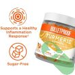 "Close-up of Bulletproof Turmeric Gummies showing peach color and gummy texture for easy daily use."

