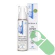 "Derma E Ultra Hydrating Dewy Skin Serum bottle alongside fresh green tea leaves and squalane oil"

