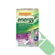 Powder from Emergen-C Energy+ Blueberry Acai packet dissolving in clear glass of water with fizz

