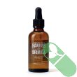 "Hawkins & Brimble Beard Oil 50ml with fresh natural ingredient elements displayed"

