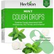 Herbion Naturals Mint Flavored Cough Drops resting on a white background with clear branding

