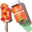 "Close-up of HUM Glow Sweet Glow Skin 60 Vegan Gummies label highlighting key ingredients like hyaluronic acid and vitamin C."

