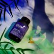 Hum Turn Back Time UV Damage Control Supplement bottle with purple label and 60 vegan capsules.

