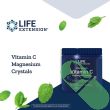 "Life Extension Effervescent Vitamin C Magnesium Crystals 180g bottle next to a glass of water"

