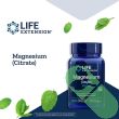 “Side view of bottle highlighting non-GMO and gluten-free icons on Life Extension Magnesium Citrate 100 mg”

