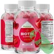 "Close-up of red cherry flavored gummy vitamins from Phytoral supplement bottle"

