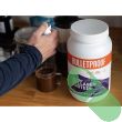 "Bulletproof Keto Friendly Collagen Protein Powder – Chocolate 42.3 oz mixed in a glass"