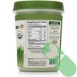 "Scoop of BareOrganics Wheat Grass Powder ready to mix into smoothie"

