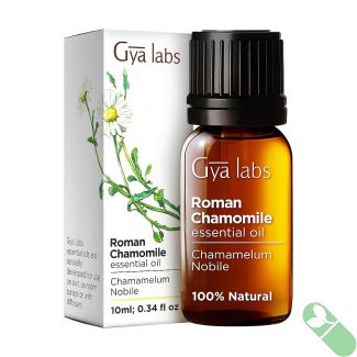 Bottle of Relaxing Roman Chamomile Essential Oil on Natural Background